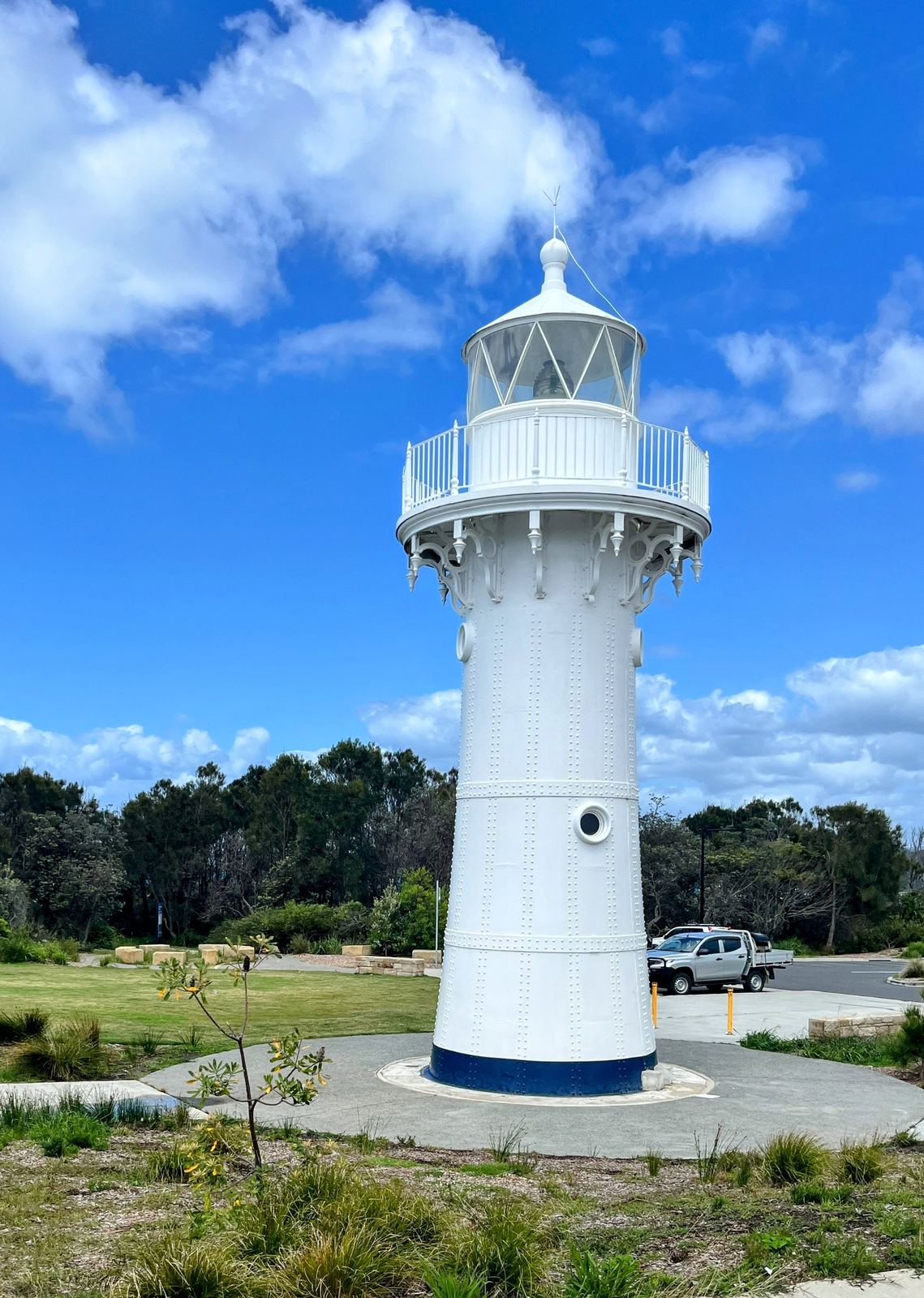 The same lighthouse a couple of minutes later with heavier cloud behind it and the headland scrub around its base